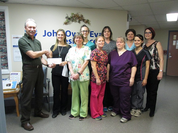 long-term-care, Chairman of the Board, Mr. J. McPherson congratulates Manager of LTC, Ms. Keri Cloutier and Long Term Care staff pictured here, with Nursing Executive Ms. L. Heerema 